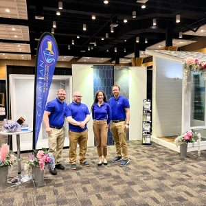 Professional Remodeling team. Calahan Bath, Kitchen & Sunrooms. The Calahan team working a decorated booth at a home show event.